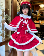 Model wearing a Sweet Lolita dress in crimson red with white fur trim and a matching hat. Ideal for winter events.