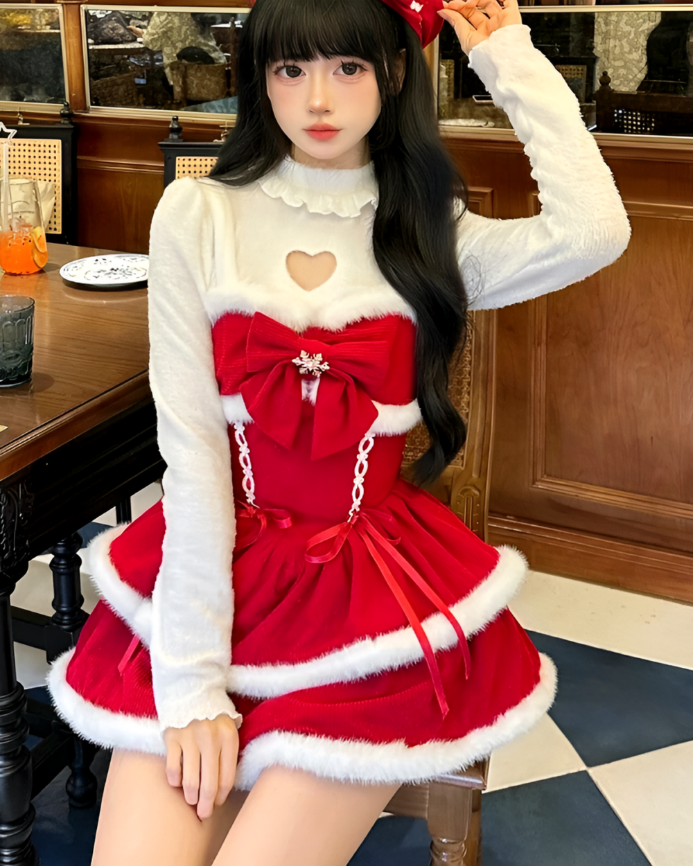 Model wearing a Sweet Lolita dress, crimson red, with white trim and a heart-shaped neckline. Ideal for winter events.