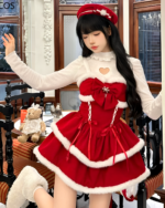 Model wearing a Sweet Lolita dress in crimson red and white, with a matching hat. A festive Sweet Lolita dress for winter.