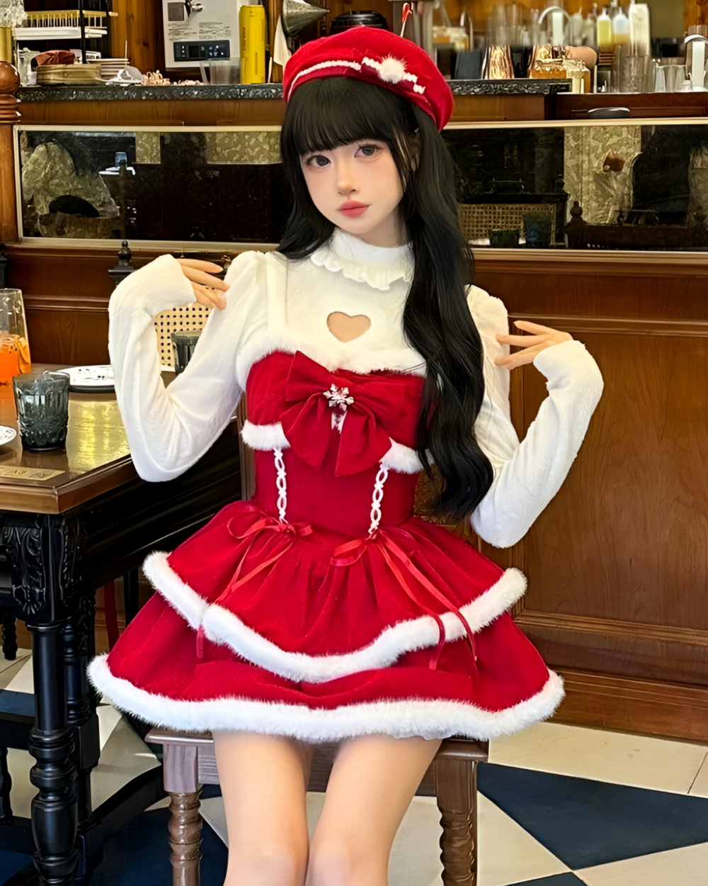 Model wearing a Sweet Lolita dress, a red and white Christmas-themed design with a heart-shaped neckline.
