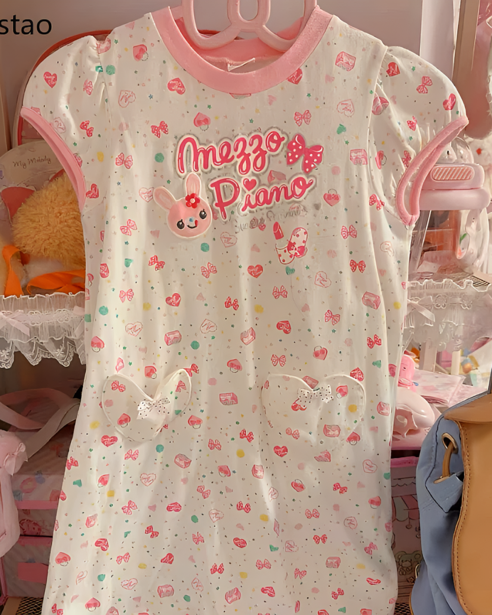 Pink Sweet Lolita top with a floral and butterfly pattern, featuring the "Mezzo Piano" logo. A cute aesthetic style.