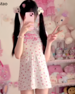 Model wearing a pink Sweet Lolita top with a floral pattern and short sleeves. Jojifuku aesthetic fashion.