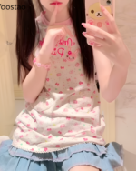 A woman wearing a Sweet Lolita top with a strawberry and bunny print. Aesthetic Jojifuku style long top.