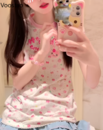 Person wearing a Sweet Lolita top with a strawberry and flower print, posing for a selfie.