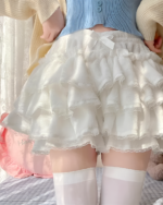 White Sweet Lolita Plush Skirt with ruffles and lace trim, layered over stockings.