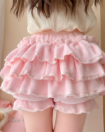 Close-up of a pink Sweet Lolita Plush Skirt with ruffles and lace trim.