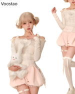 A model wearing the Sweet Lolita Set - Creamy Edition, featuring a long-sleeved top and layered skirt.