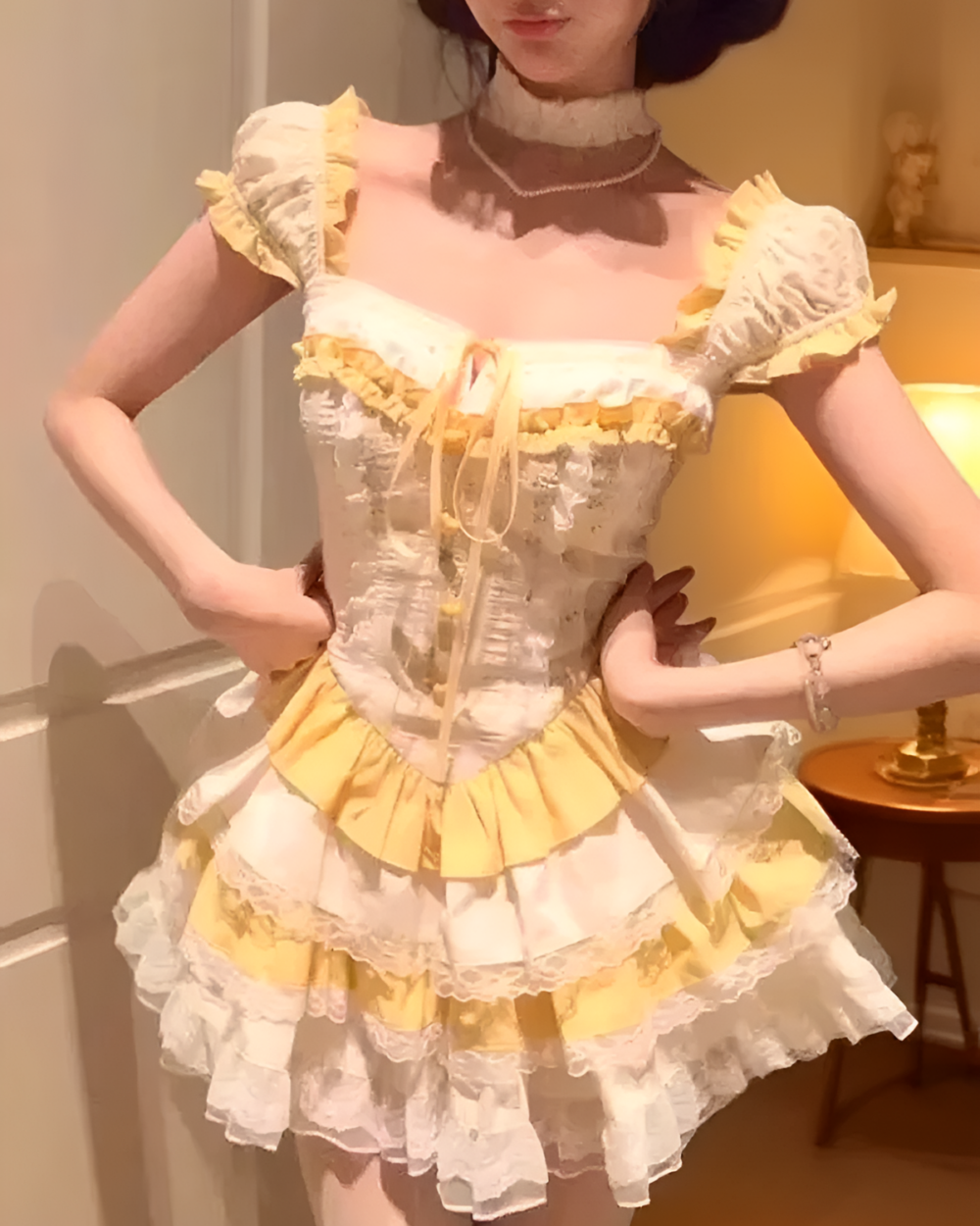 Close-up of a yellow Sweet Lolita dress with ruffles, lace, and a corset bodice.