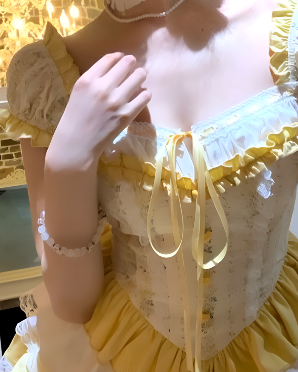 Close-up of a yellow Sweet Lolita dress with lace details and a corset bodice.