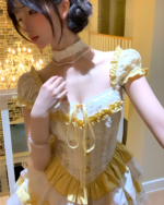 Yellow Sweet Lolita dress with lace details, ruffled sleeves, and a high neckline.