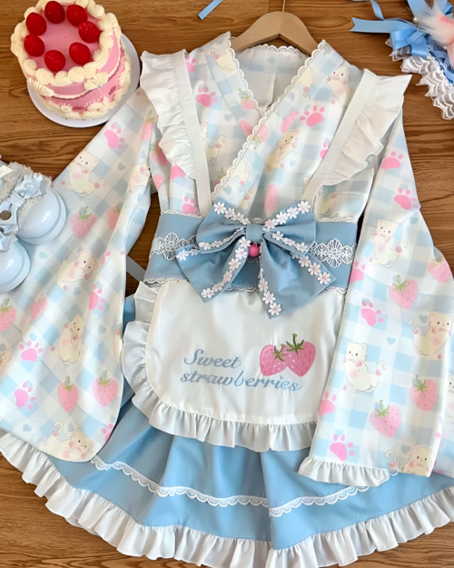 Sweet lolita dress with strawberry and mouse motifs on a blue and white gingham pattern, paired with cake and accessories.