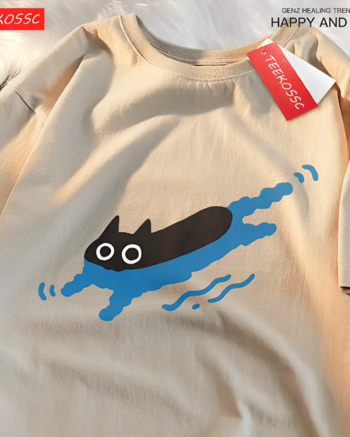 Kuro Neko T-Shirt with a graphic of a black cat swimming in blue waves. Beige cotton fabric.