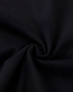 Close-up of the black fabric texture of the Kuro Neko T-Shirt. Soft, comfortable material.