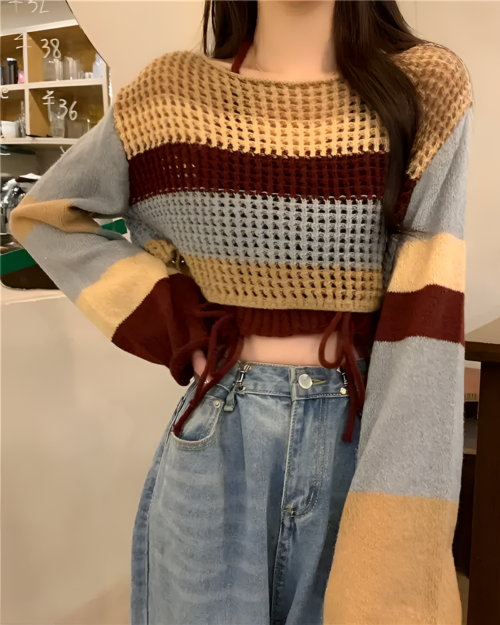 Brown and beige knitted autumn set sweater with denim jeans.