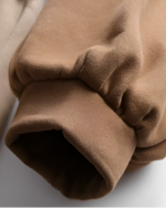 Close-up of a brown Bearcore hoodie, showcasing the fabric texture.