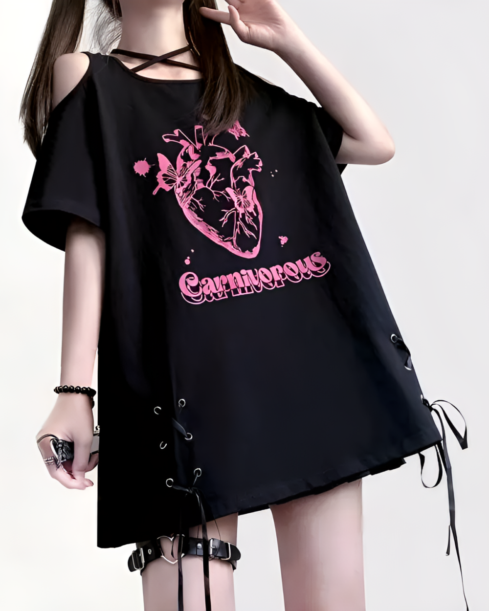 Black gothic oversized tee featuring a detailed anatomical heart graphic and "Carnivorous" text.