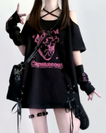 Black gothic oversized tee featuring a carnivorous heart graphic and text. The Carnivorous tee includes cutouts and accessories.