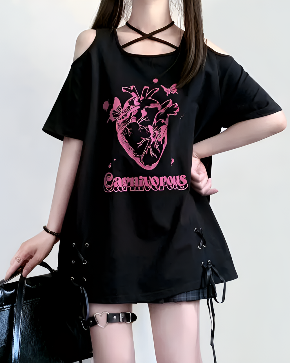 Black gothic oversized tee with an "Carnivorous" print of a heart and butterflies.