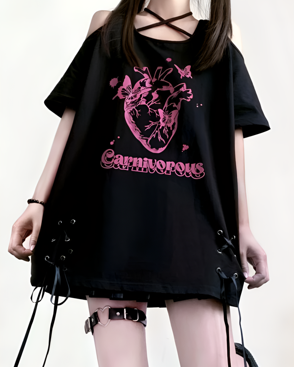 Black gothic oversized tee featuring a pink heart and butterfly print. The Carnivorous Tee.