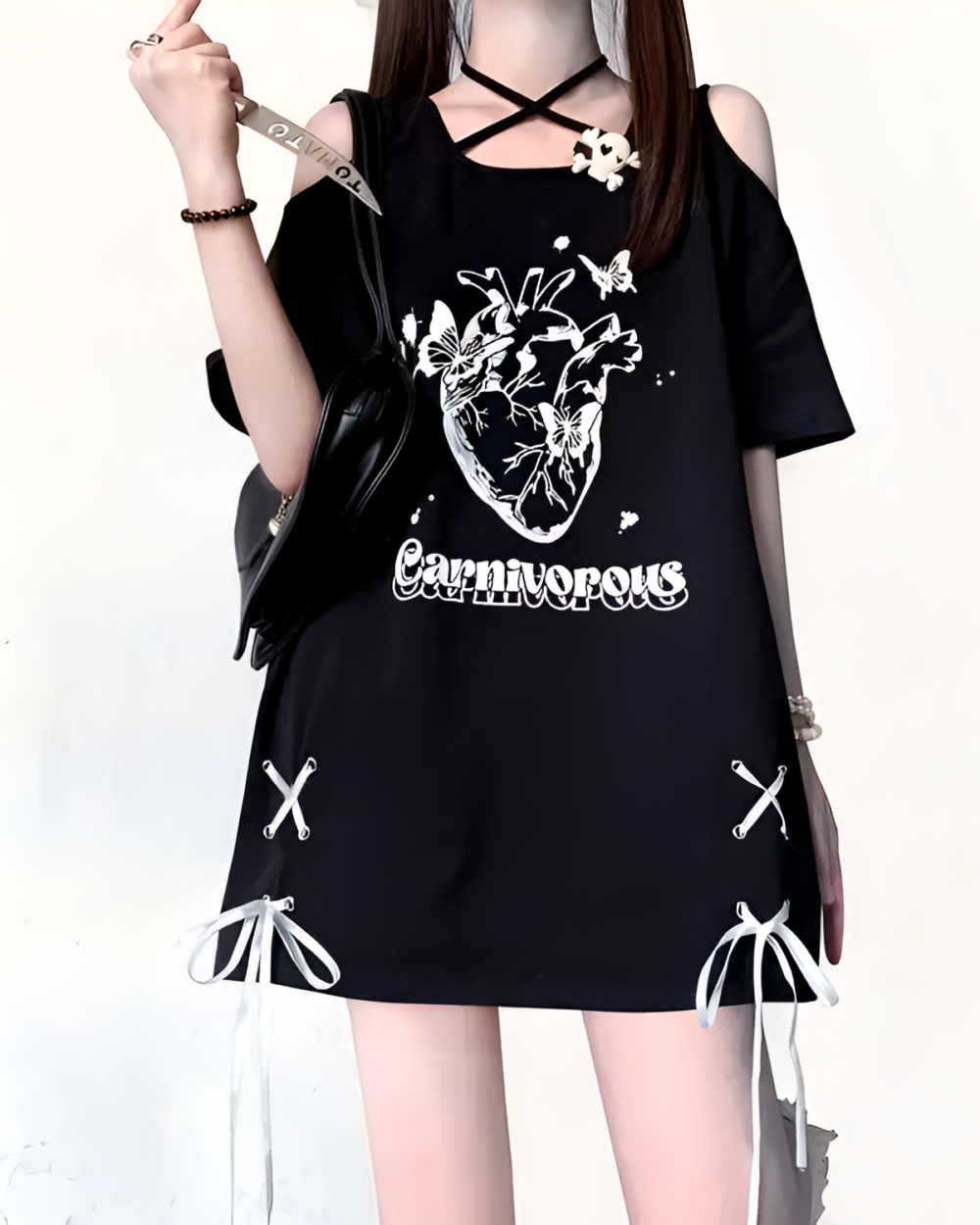 Black gothic oversized tee featuring an embroidered heart and 'Carnivorous' text.