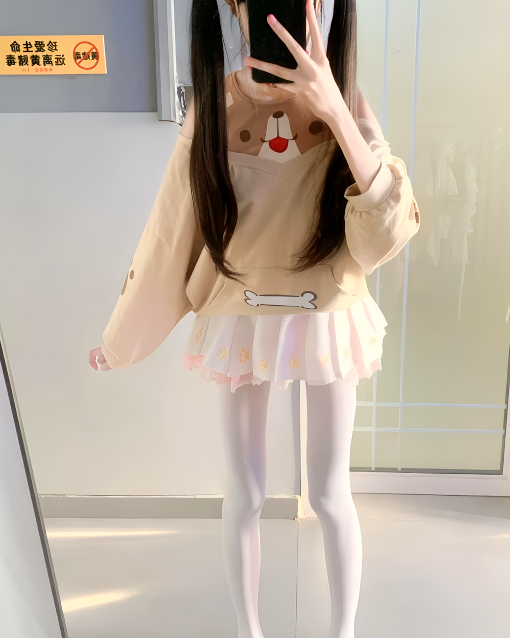 Woman modeling a Jojifuku aesthetic outfit including a Doggy Sweatshirt and cream-colored skirt. The Doggy Sweatshirt features a bear design.