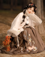 A girl wearing a Qi Lolita Traditionally Inspired Fluffy Dress with embroidery and a faux fur jacket.