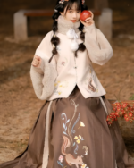 A model wearing a Traditionally Inspired Fluffy Dress - Qi Lolita, featuring embroidery and a faux fur jacket.