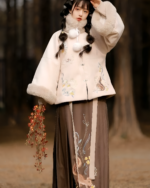A woman wearing a Qi Lolita Traditionally Inspired Fluffy Dress, featuring embroidery and a faux fur collar.