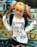 Person wearing a white long-sleeve Transluscent Nothingness T-Shirt with graphic design and black vest.