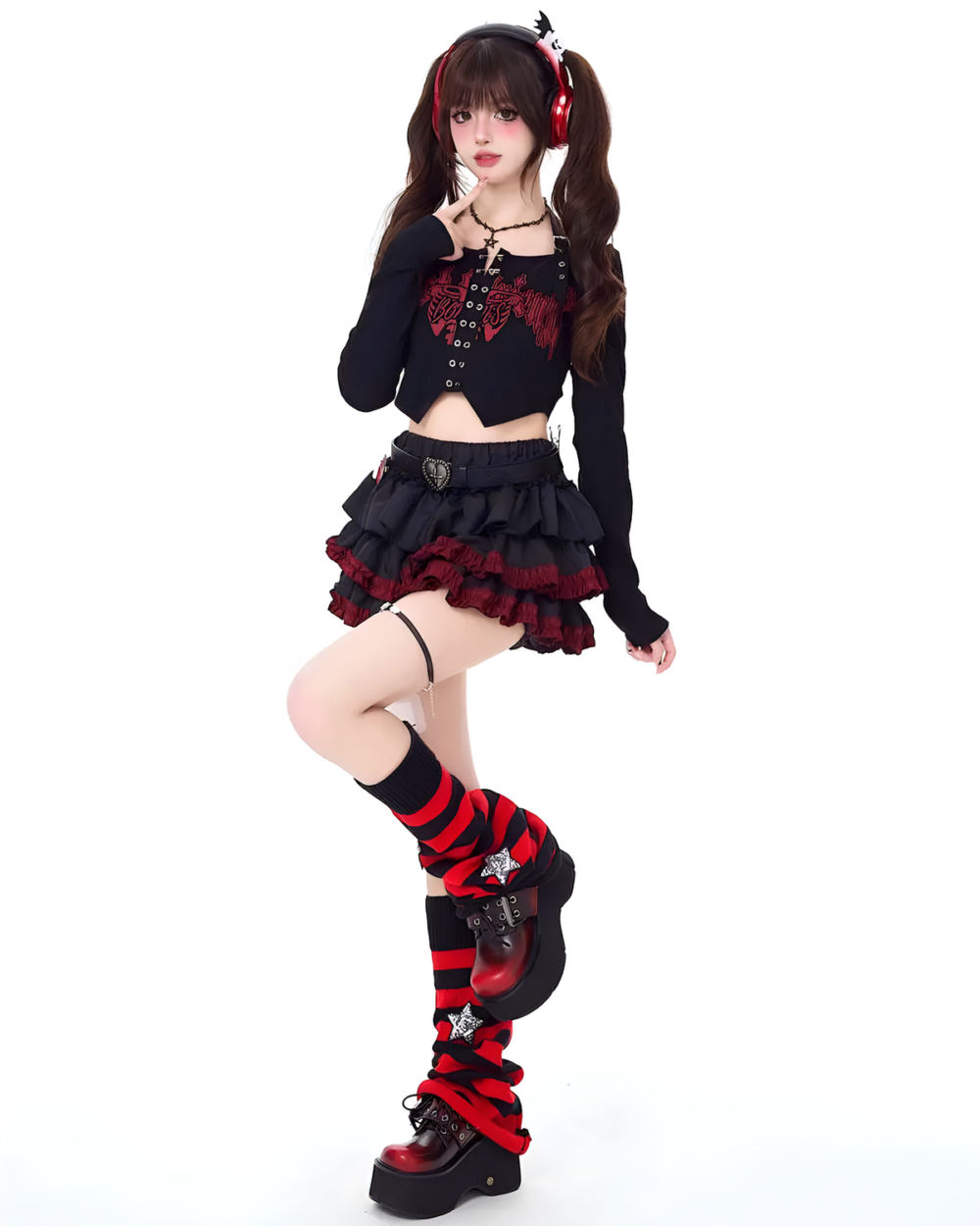 Model wearing a black and red Venom Heart Ruffle Skirt set with a ruffled mini skirt and a cropped top.