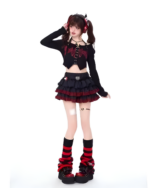 Model wearing the Venom Heart Ruffle Skirt set, a black and red ruffled mini skirt and long-sleeved crop top.