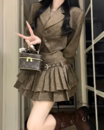 Brown vintage pleated dress suit with a belt and handbag.