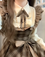 Vintage midi dress featuring ruffles and a bow, embodying a cottagecore aesthetic.