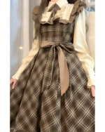 Vintage midi dress in a cottagecore aesthetic, featuring a plaid skirt and ruffled blouse.
