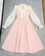 Vintage midi dress featuring a cottagecore aesthetic with lace details and a bow tie.