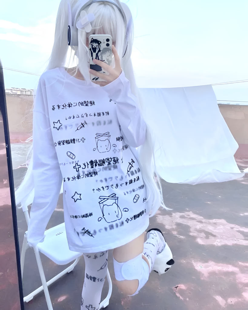 Model wearing a White Oversize Neko T-Shirt with a cutecore aesthetic and Japanese text print. Casual streetwear style.