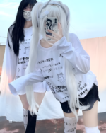 Person wearing a White Oversize Neko T-Shirt with a cat graphic and Japanese text. Cutecore aesthetic fashion.