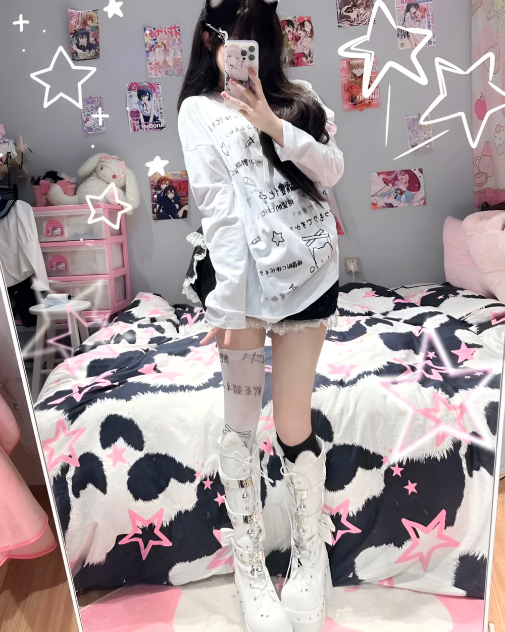 A person wearing a White Oversize Neko T-Shirt with cow print bedding and accessories in a bedroom setting.