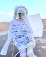 Person wearing a White Oversize Neko T-Shirt with Japanese text graphic. Cutecore aesthetic clothing.