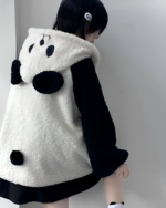 Person wearing a white and black panda fleece hoodie, a Winter Hooded Coat - Panda Edition.