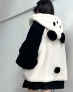Woman wearing a Winter Hooded Coat - Panda Edition, a cozy black and white panda fleece hoodie with bear ears.
