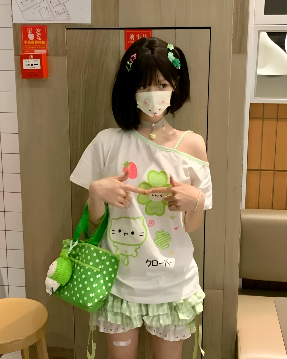 Person wearing Yotsuba Neko T-Shirts featuring a cute cat design and accessories.