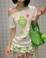 White Yotsuba Neko T-Shirts featuring a green cat and strawberry design.