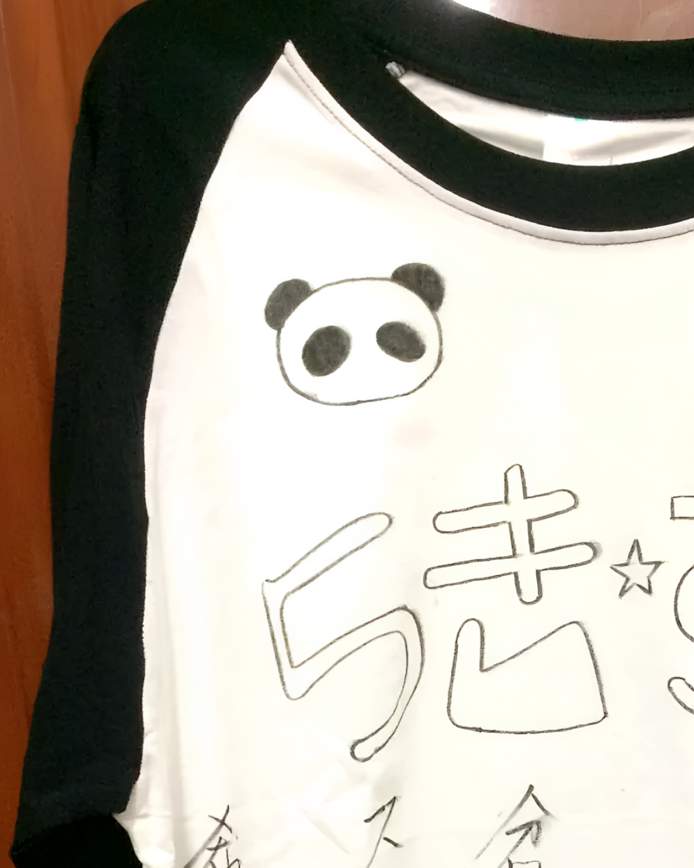 らき☆すた Contrast Long Sleeve T-Shirt showing panda graphic and text design.