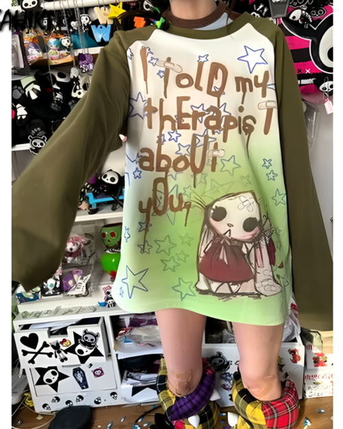 I Told My Therapist shirt with graphic design featuring an illustration and stars.