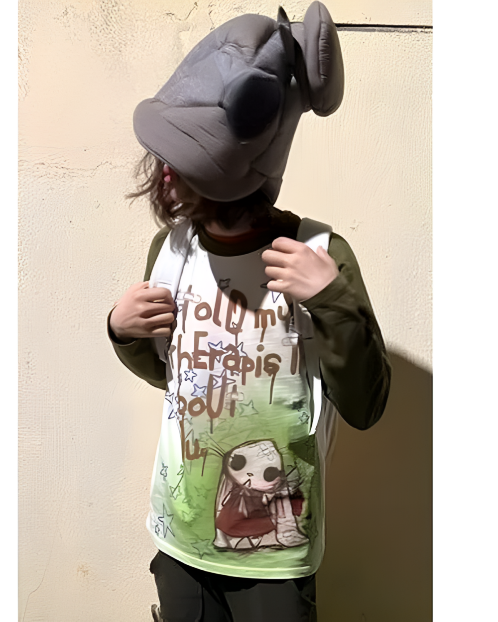 Model wearing an "I Told My Therapist shirt" with a kawaii design.