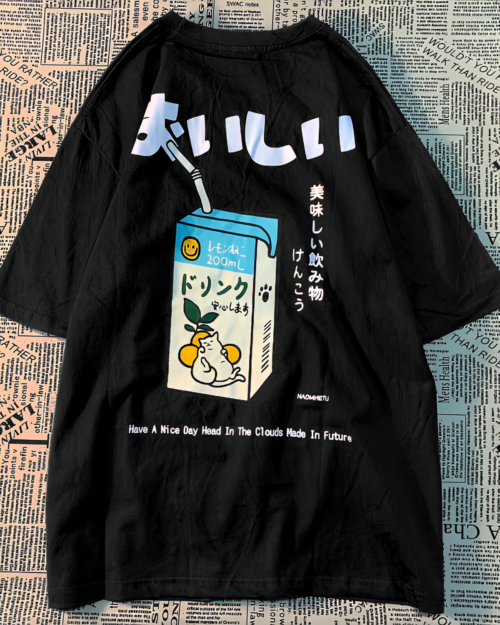 Black long sleeve kawaii cat shirt with a milk carton and Japanese text. Features the "おいしい" design.