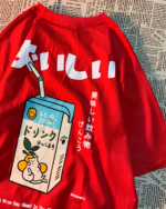 Red t-shirt featuring a kawaii cat shirt design with a milk carton and Japanese text. The text reads "おいしい".